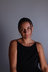 Portrait of beautiful woman on grey background