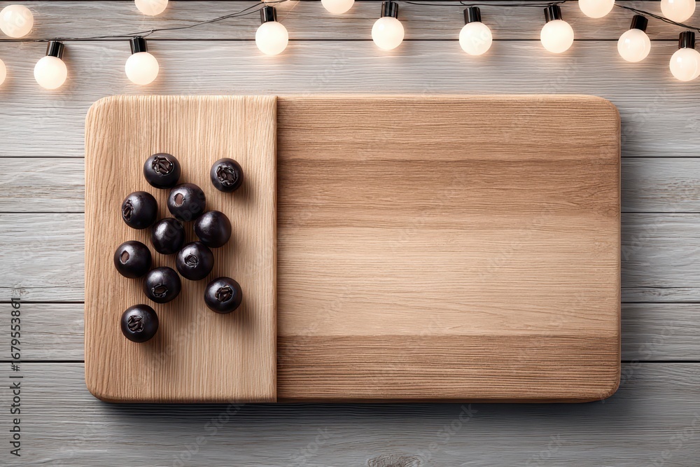 Poster a rustic wooden cutting board with fresh blueberries displayed under ambient string lights, providin