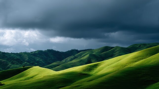 Rolling green hills under dramatic dark storm clouds