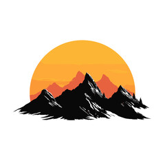 Silhouette of mountains against a vibrant orange sunset  