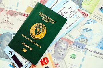 Nigerian naira currency money bills with tickets and passport. The concept of travel and vacation