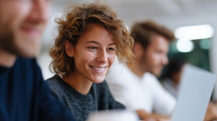 A dynamic startup team collaborating passionately in a bright open office with laptops and coffee cups