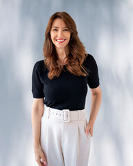 Cropped shot of a businesswoman standing against isolated background and smiling at camera