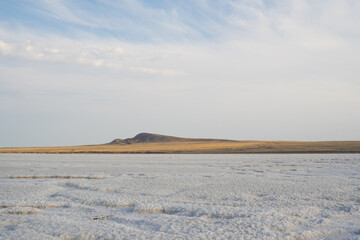Landscape of salt lake Baskunchak. View of Mount Bolshoe Bogdo. Astrakhan region. Russian landscape.