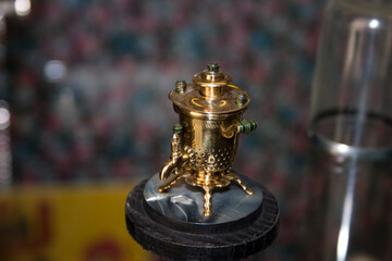 Close-up of a copper samovar in a shop window