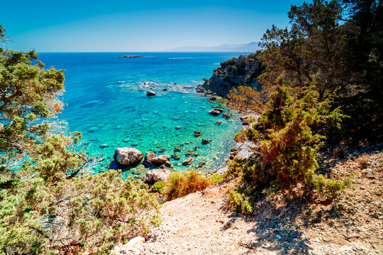 Top view of a beach in a bay with turquoise lagoon. Mediterranean Sea, Akamas Peninsula, Neo Chorio near Latchi.	
