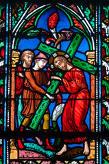 Stained glass (19th century) of the Way of the Cross. Fifth station: Simon of Cyrene helps Jesus...