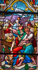 Stained glass (1914) of The Way of the Cross. Seventh station: Jesus falls for the second time.