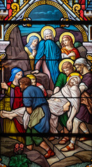 Stained glass (1914) of The Way of the Cross. Fourteenth station: Jesus' body is placed in the tomb.