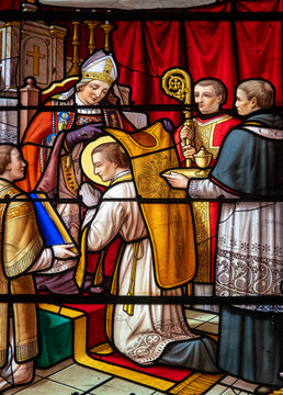 Stained glass (1914) of ordination of saint John Mary Vianney the Holy priest of Ars. Saint of the Catholic Church.