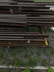 Old Metal Pipes and Framework Against a Green Wall