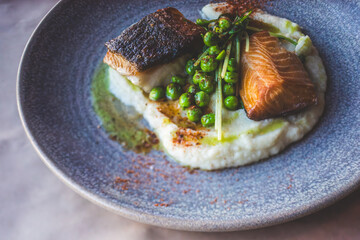 Oysters and Salmon on Trendy Ceramic Plate with Brown Paper Table Setting