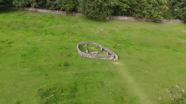 Eyam, The Peak District, England - August 6 2025: Drone footage captures the Riley Graves, a poignant reminder of the village's plague history.
