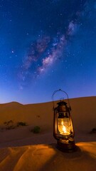 Desert night scene with a lantern and Milky Way