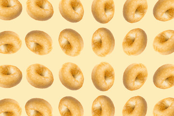 Bagel Pattern on Yellow Background, Round Bread Bun Minimal Wallpaper with Copy Space