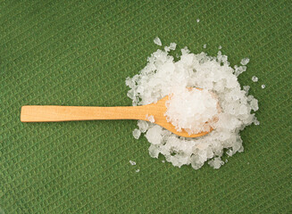 Obraz na płótnie Canvas Dead sea salt pile, white crystals for body spa, sodium chloride similar to crushed ice, spa scrub