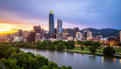Fototapeta premium City skyline at sunset over a river (5)