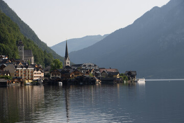 Photography of Hallstatt, Austria, showing the picturesque alpine village by the lake, historic houses, mountains in the background, and serene European landscape.