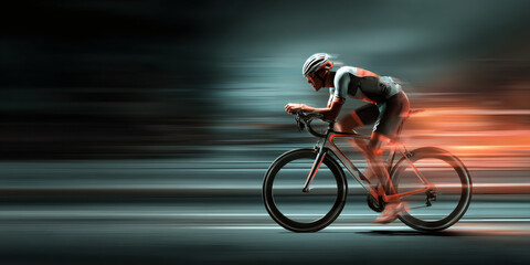 Man cyclist in white uniform and orange glasses speeding on road bike. Sport and fitness activity. Dynamic motion blur background.