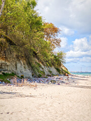 A beautiful beach on Baltic sea in Kaliningrad Russia with a blue ocean and a rocky shore