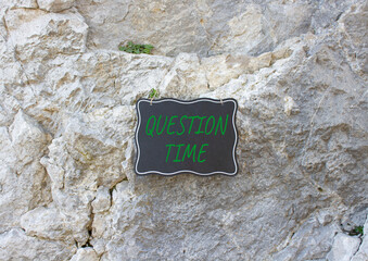 Question Time symbol. Stone wall with words Question Time. Beautiful stone background. Business and...