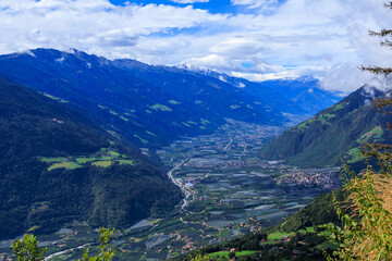 Obraz premium View from Hochmuth mountain station towards valley Etschtal with mountain panorama and summit Hasenöhrl in South Tyrol, Italy