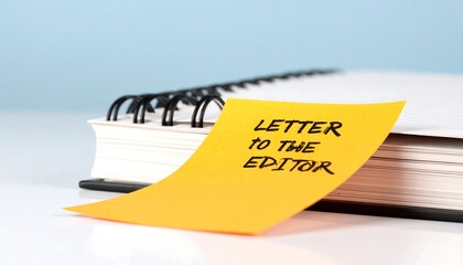 Yellow sticky note with text "Letter to the Editor" on a notepad