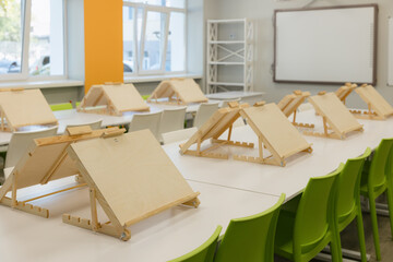 Workshop space with wooden easels arranged for creative activities in a bright classroom