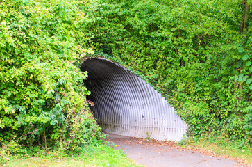 Corrugated metal tunnel under road in Germany used for safe pedestrian passage