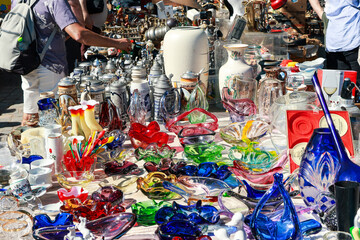 sale of colorful glassware at a flea market
