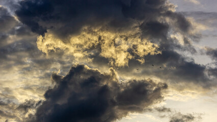 dramatic sky with clouds at sunset