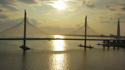 Cable-stayed bridge and new skyscraper at sunset