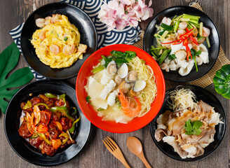 Miso Assorted Noodle Soup, Shrimp with Egg, stir fried assorted seafood with shrimp, scallops, squid, and red chili, Sweet and Sour Spare Ribs, Garlic Pork, side view of hong kong food
