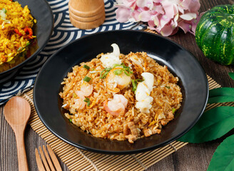 Classic mixed fried rice with shrimp, meat, and fresh scallions in bowl side view of hong kong food