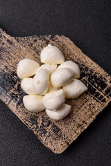 Mozzarella cheese balls, fresh white mini slices for Mediterranean food. Mozzarella cheese