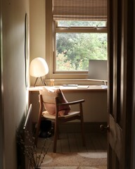 Cozy work table in a room with a window
