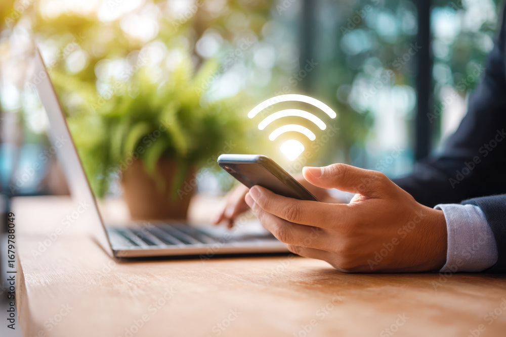 Aufkleber person using smartphone with wireless signal icon in a modern workspace setting