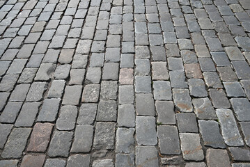 Abstract background. Old cobblestone pavement closeup