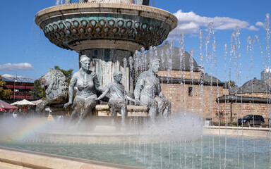 a fountain in skopje's main square featuring the warrior on a horse statue of king philip ii of...