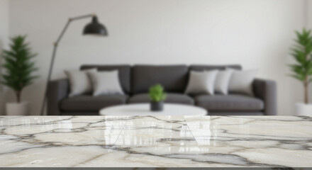 A blurred living room scene featuring a marble countertop in the foreground and a gray sofa behind