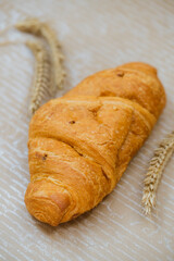 Croissant with rye on table. Kitchen