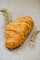 Croissant with rye on table. Kitchen