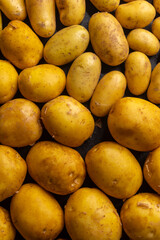 Freshly harvested potatoes forming a textured background