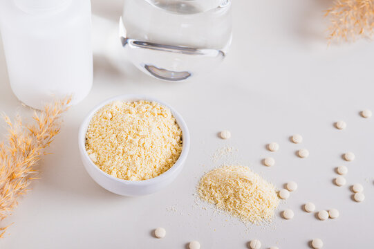 Health food with peptides and water in a glass on the table