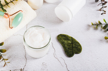 Moisturizing cream with beef tallow in a jar on the table