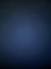 Dark blue night sky with some bright points stars