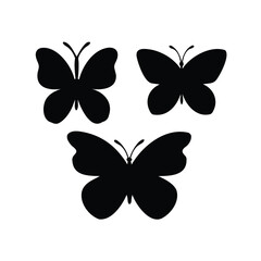 Fototapeta premium Three beautiful butterfly silhouettes in a dynamic arrangement on a white background