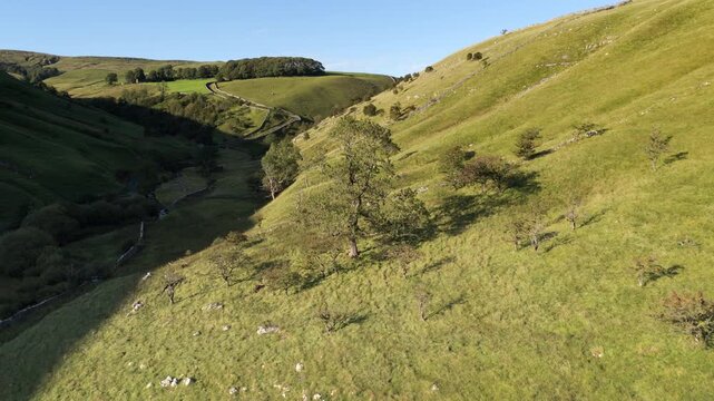 Majestic Aerial View of Kettlewell Valley with Rolling Green Hills and Stone Walls, North Yorkshire.