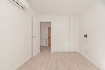 Small bedroom design with beveled mirror wardrobe that reflects light and creates spaciousness