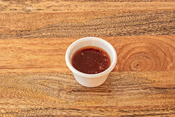 Small   ceramic bowls with thick homemade tomato sauce, decorated with   touch of color